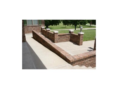 Front courtyard entrance has a discreetly placed r