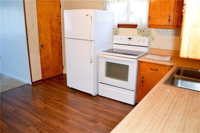 Eat in Kitchen has new Pergo floors and appliances