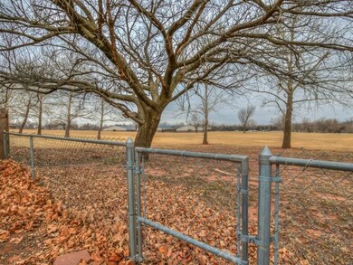 The back gate opens to the grounds of Centennial E