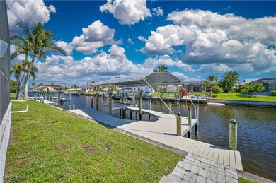 Dock area with boat lift, a residential view, a wa