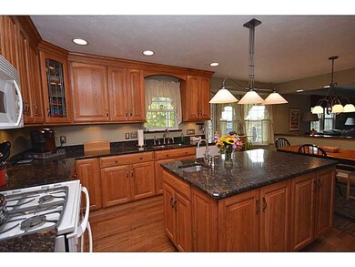 Kitchen. Island features a sink with disposal. Ele
