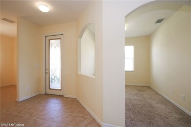 Light & Bright Entry with Glass Front Door and Den