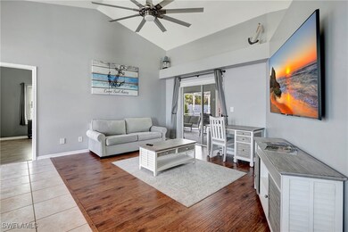 Living area with high vaulted ceiling, a ceiling f