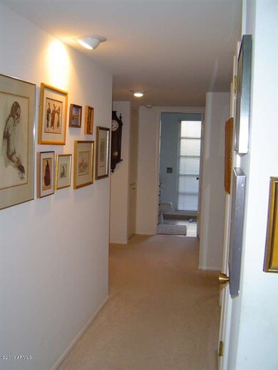 Hallway leads to Bdrms