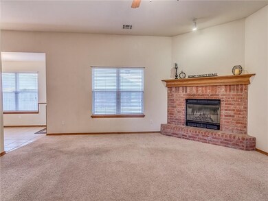 Large open living area with Brick fireplace that h