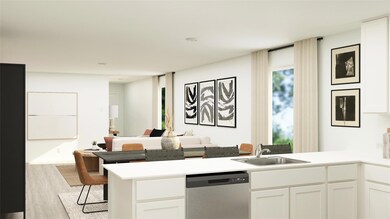 Kitchen featuring sink, white cabinets, stainless 