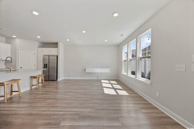 Unfurnished living room featuring recessed lighting and light wood-style flooring