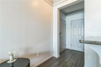 Bathroom with ornamental molding and hardwood / wo