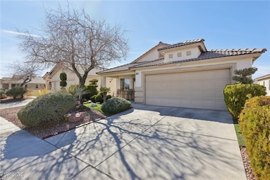 Mediterranean / spanish-style home with a garage