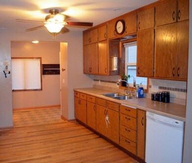 view from the dining across the kitchen and also m
