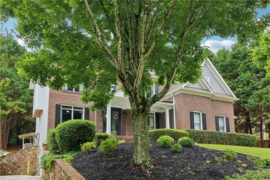 Obstructed view of property featuring brick siding