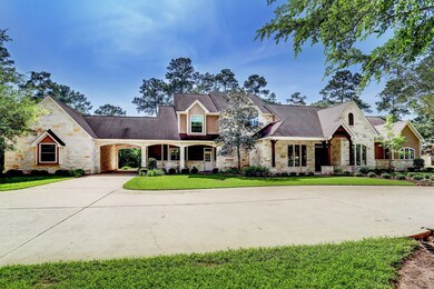 3 car garage, porte-cochere and a lush lawn.