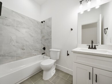 Conveniently located near the bedrooms, this bathr