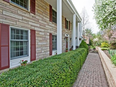 Inviting brick walk way and beautifully landscaped