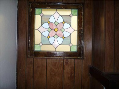 Living Room. One of two stained glass windows in the living room