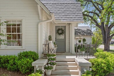Property entrance with roof with shingles and cov