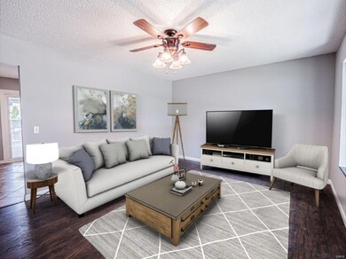 Large family room is super cozy!  Virtually staged