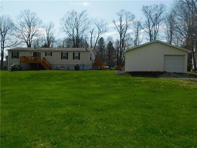 REAR OF HOME. GARAGE ALSO HAS SECOND EXIT TO REAR 