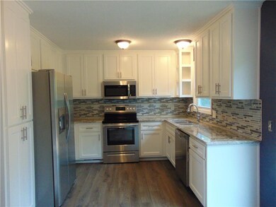 Brand new kitchen with custom made cabinets, grani