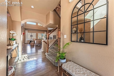 Foyer entrance with stairs, wood finished floors, 