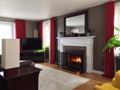 Grand Living room with wood burning fireplace with
