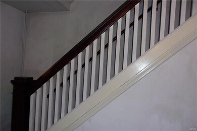 Open staircase in dining rm.