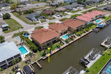 Aerial view of residential area with a pool and a