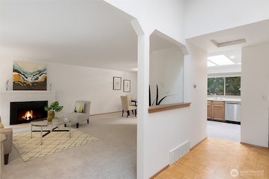 Step inside and feel the warmth right away - fresh interior paint adds a crisp, updated feel, while the skylight overhead bathes the entry in natural light. It’s the perfect welcome to a home that instantly feels good to be in.