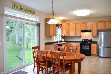 The dinette has a sliding door to the backyard.
