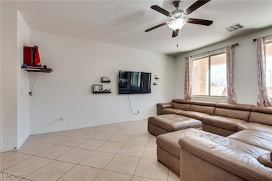 Living area with light tile patterned flooring, a