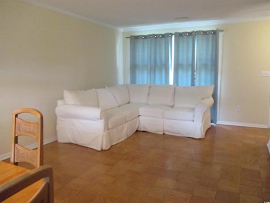 Living room featuring ornamental molding