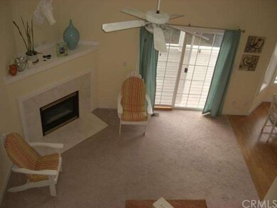 Looking down into Living Area from Balcony above.
