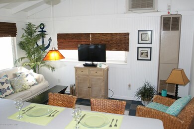 Living room w/ vaulted ceiling