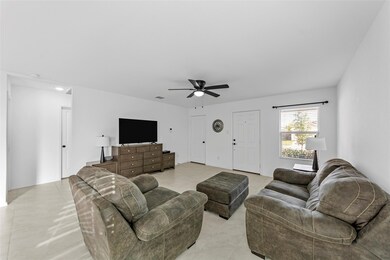 Tiled living room with ceiling fan