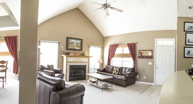 Vaulted ceiling and cozy fireplace.