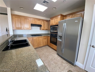 Kitchen featuring visible vents, recessed lighting