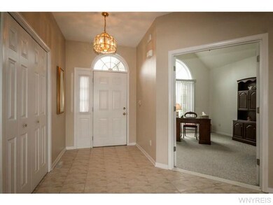 Family Room front hall with double closets & Frenc