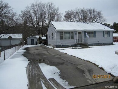 Nice concrete driveway continues around back of ho