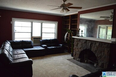 Large living room features a beautiful stone firep