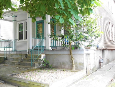 Front faade (right side) looking SE from street.