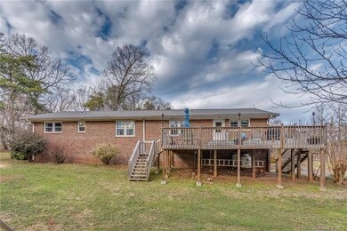 Backside of home with multi-level entertaining dec