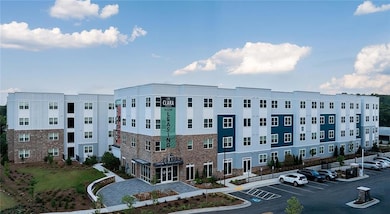 View of property with uncovered parking