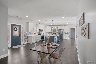 Dining space with LVP flooring and recess lighting