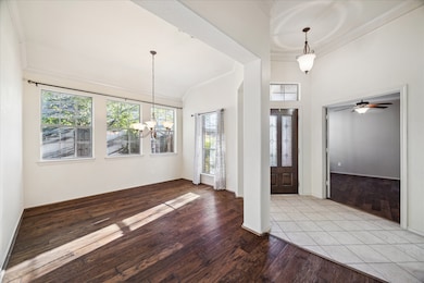 View from the dining room toward the front door and bedroom 1/ office space.