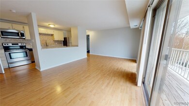 Kitchen featuring decorative backsplash, light har