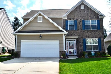 Wide driveway, 2 car garage, paved sidewalk to backyard