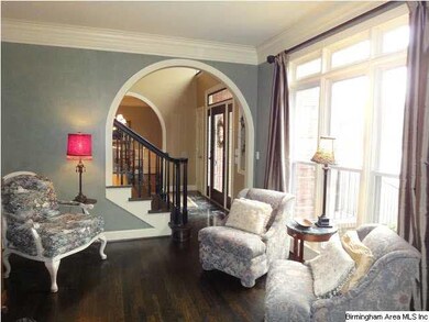 Arched entry from foyer to formal living.