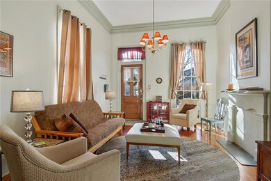 Living room with plaster crown molding, medallion,