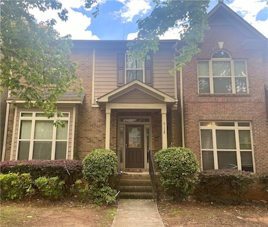 Traditional home featuring brick siding