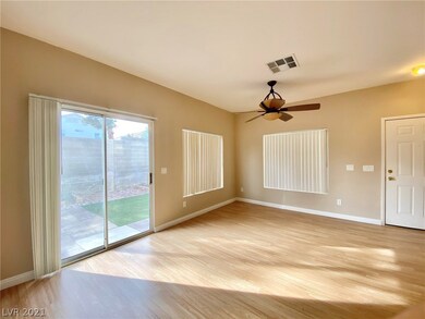 Living room with sliding door to backyard.